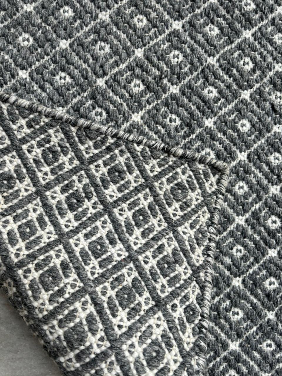 Gray & White Diamond Handwoven Wool Flat Weave Rug — side-angle view, Lav & Lira handmade rug