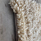 Side angle wool rug image
