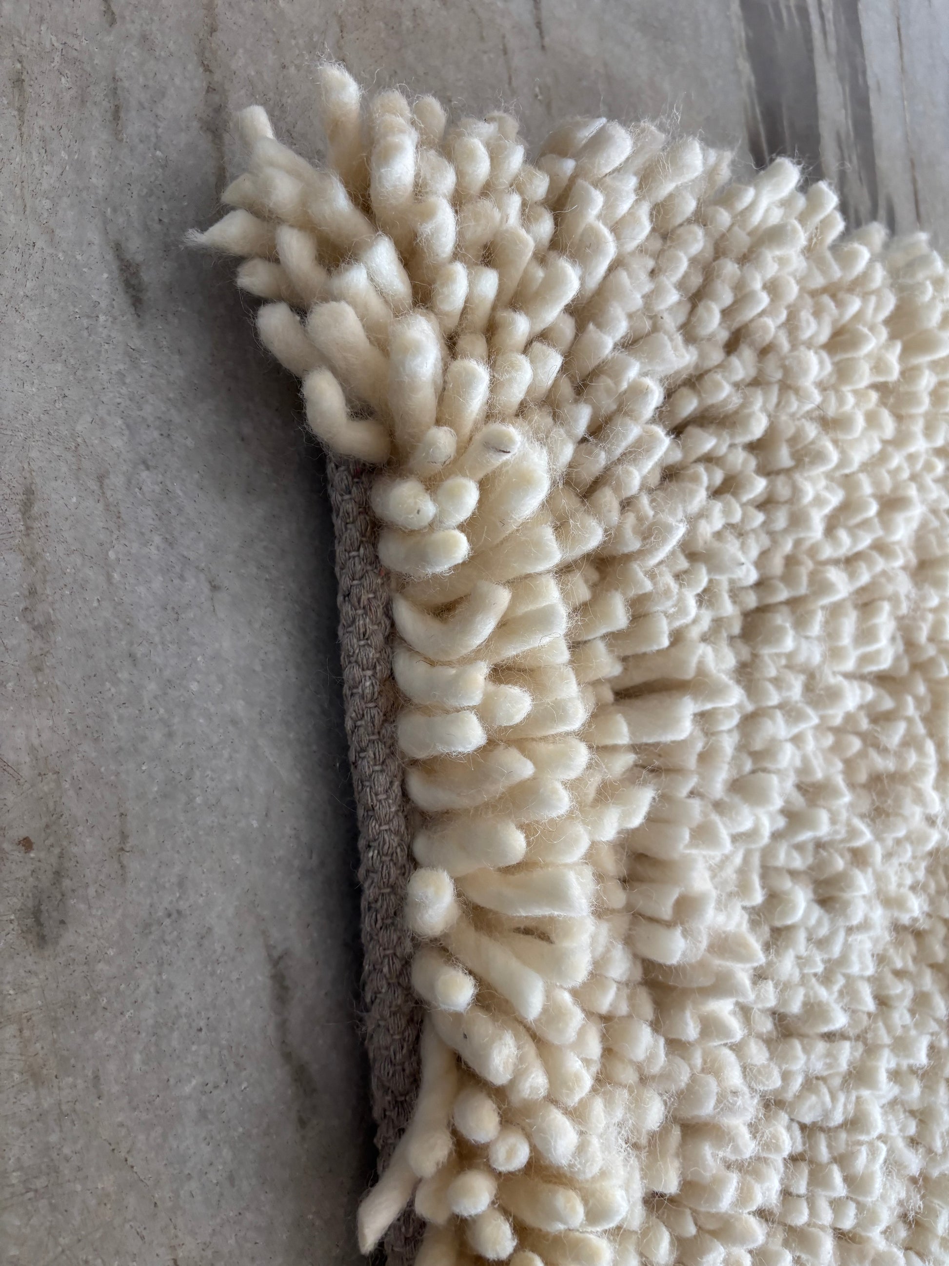 Side angle wool rug image
