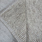 handwoven chunky loop wool rug 8x10 beige cream bordered natural wool area rug living room scale Lav and Lira