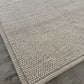 Close ups side angle ivory loop wool chunky rug with border