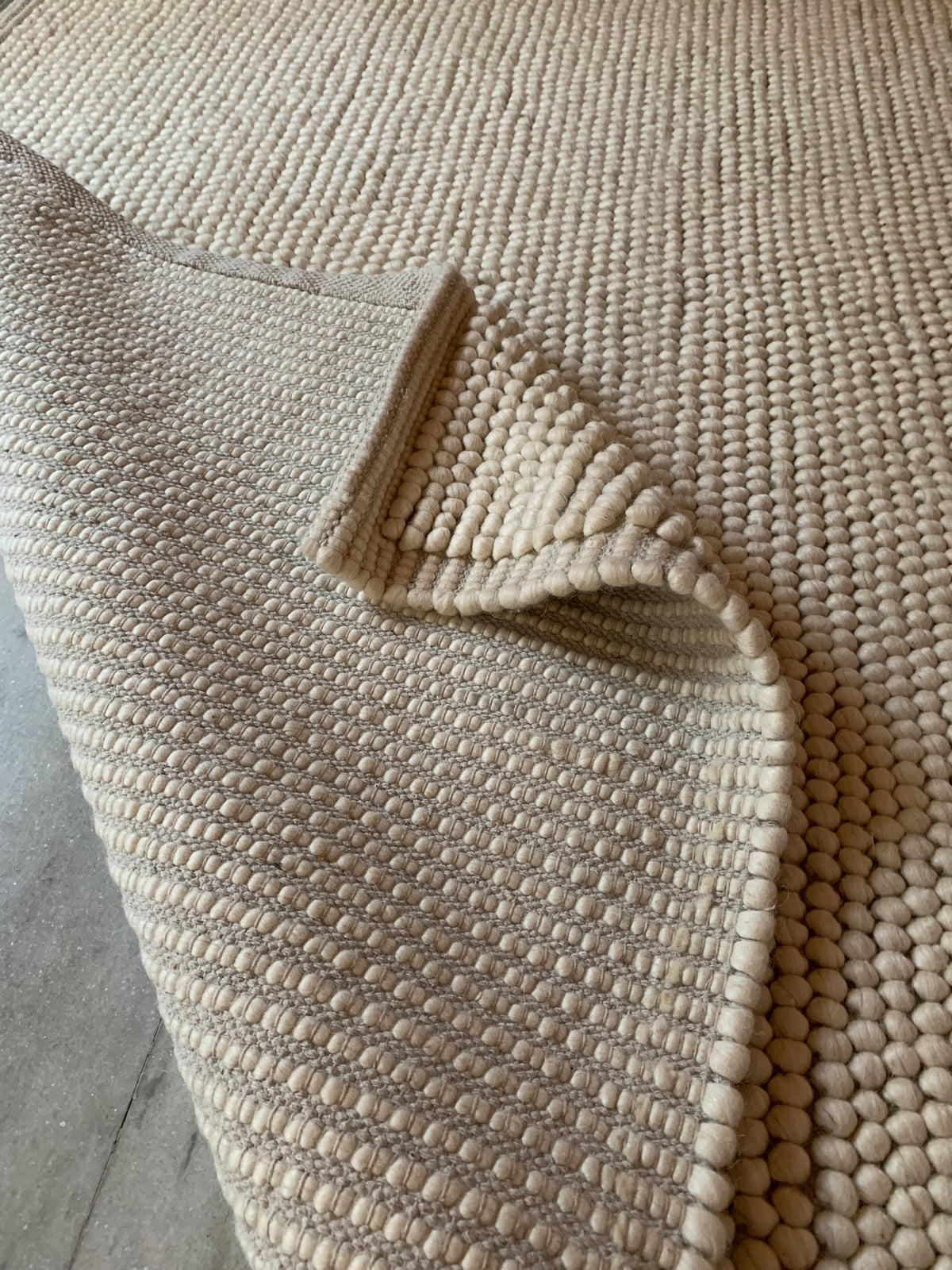 close up chunky loop wool rug texture 100 percent natural virgin wool pile depth